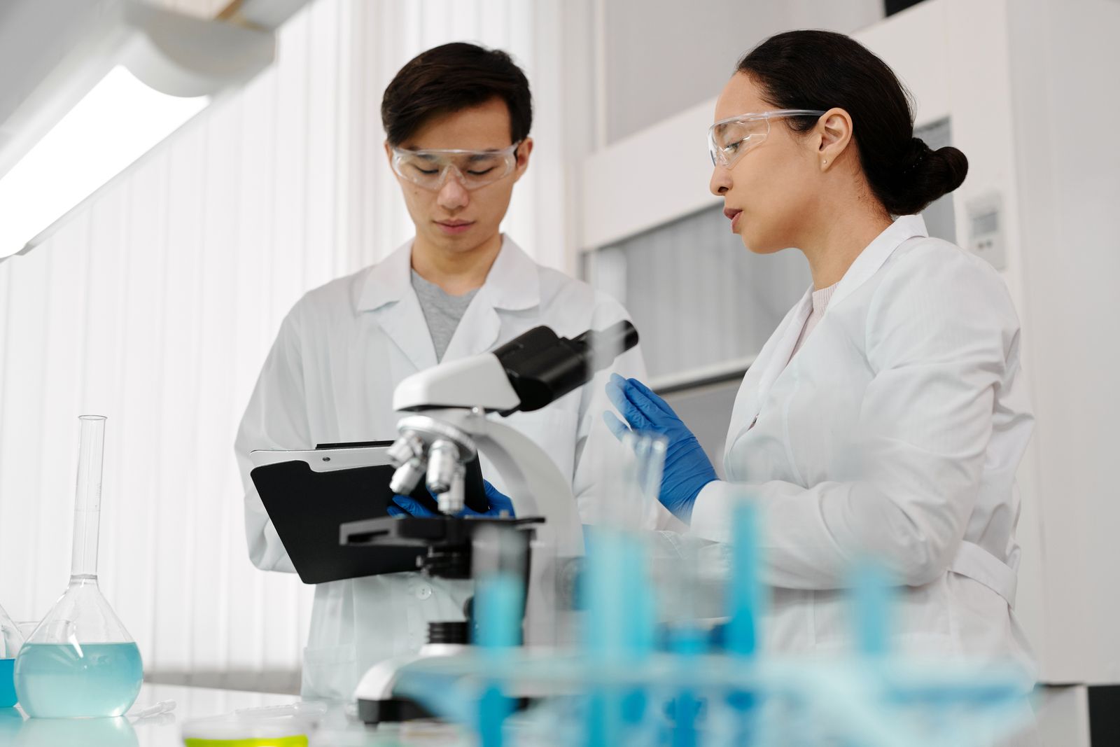 Asian scientists collaborating in a laboratory