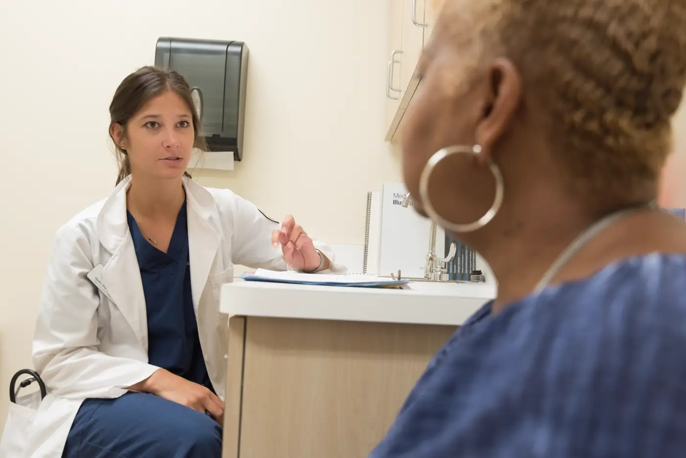 Clinician discussing health information with a patient